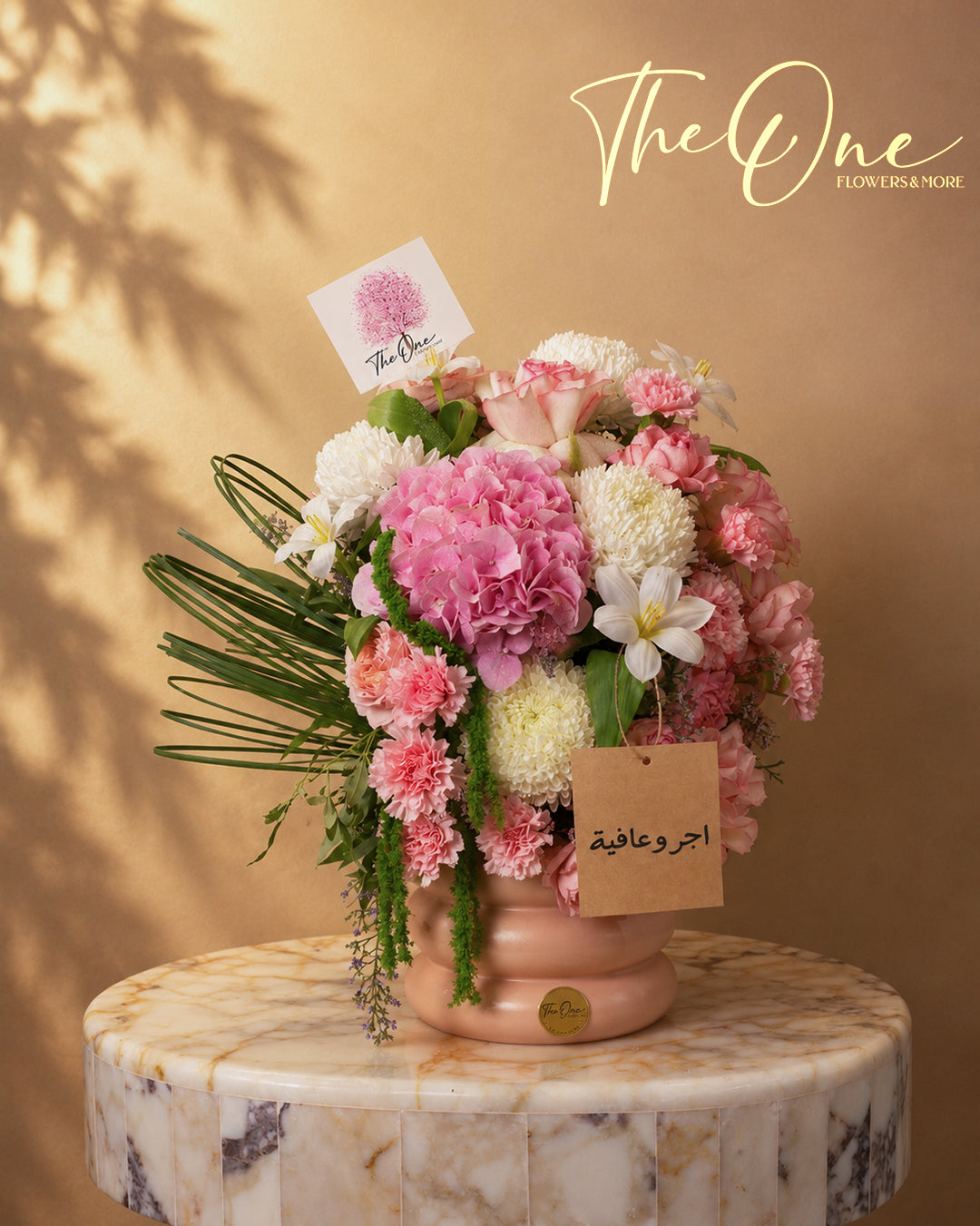 Pink and white get well soon flower arrangement with hydrangea, roses and carnations in a blush vase by The One Flowers Al Ain UAE