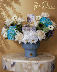 Luxury blue and white flower arrangement with blue hydrangeas, white roses and orchids by The One Flowers with delivery across UAE