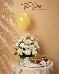 Luxury ivory and white flower arrangement with premium chocolates and balloon by The One Flowers with delivery across UAE