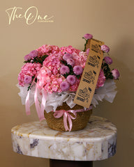 Pink graduation flower basket with hydrangeas and chrysanthemums by The One Flowers with delivery across UAE
