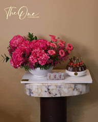 Luxury pink flower arrangement with hydrangeas, gerbera daisies and premium chocolates by The One Flowers with delivery across UAE