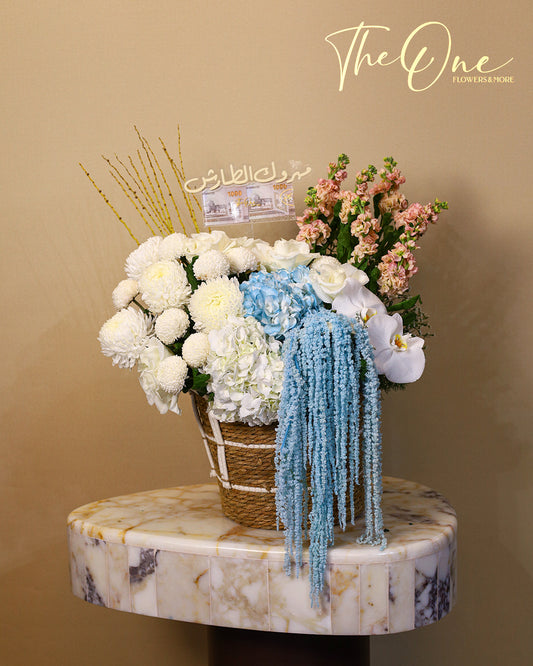 Luxury blue and white graduation flower basket with hydrangeas, orchids and cash gift by The One Flowers UAE