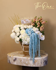 Luxury blue and white graduation flower basket with hydrangeas, orchids and cash gift by The One Flowers UAE
