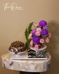 Luxury Hajj flower and chocolate arrangement by The One Flowers featuring premium fresh flowers and assorted chocolates