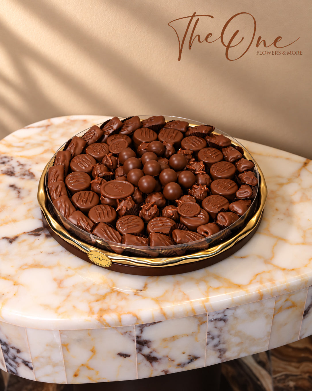 Luxury chocolate gift tray beautifully arranged with assorted wrapped chocolates by THE ONE FLOWERS, perfect for gifting and special occasions in the UAE.