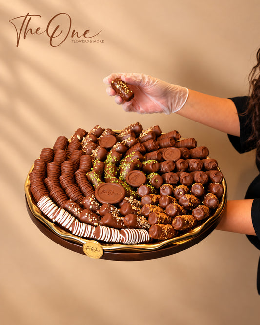 Luxury chocolate gift tray beautifully arranged with assorted wrapped chocolates by THE ONE FLOWERS, perfect for gifting and special occasions in the UAE.