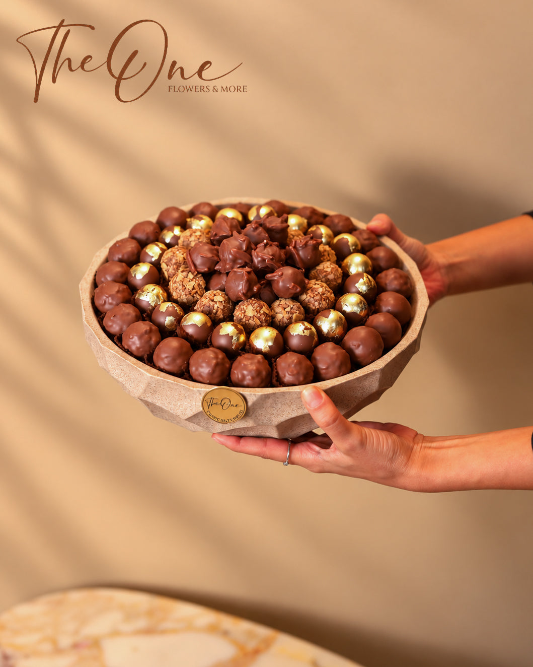 Luxury chocolate gift tray beautifully arranged with assorted wrapped chocolates by THE ONE FLOWERS, perfect for gifting and special occasions in the UAE.