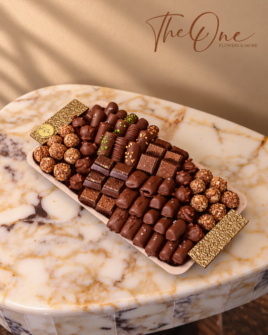 Luxury chocolate gift tray beautifully arranged with assorted wrapped chocolates by THE ONE FLOWERS, perfect for gifting and special occasions in the UAE.