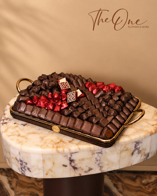 Luxury chocolate gift tray beautifully arranged with assorted wrapped chocolates by THE ONE FLOWERS, perfect for gifting and special occasions in the UAE.