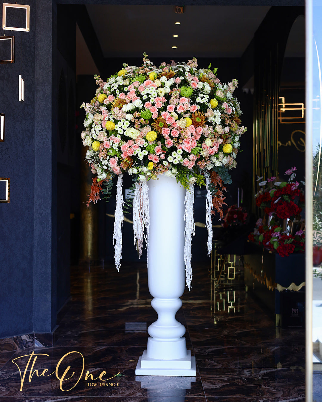 Grand luxury big flower stand with pink and white flowers by The One Flowers UAE