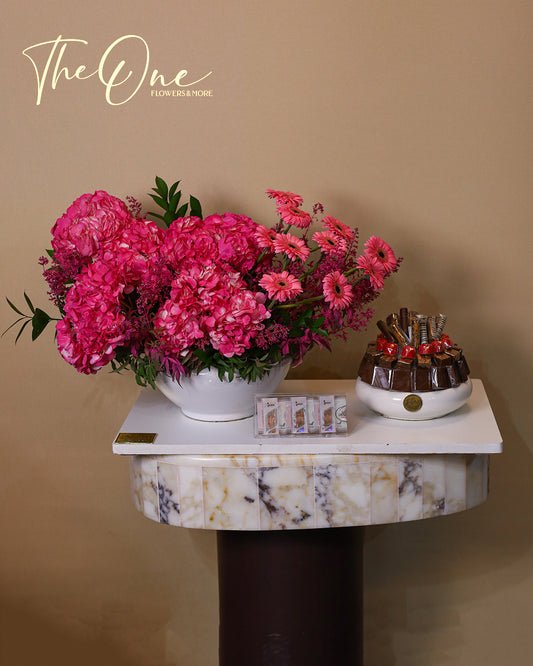 Luxury pink flower arrangement with hydrangeas, gerbera daisies and premium chocolates by The One Flowers with delivery across UAE