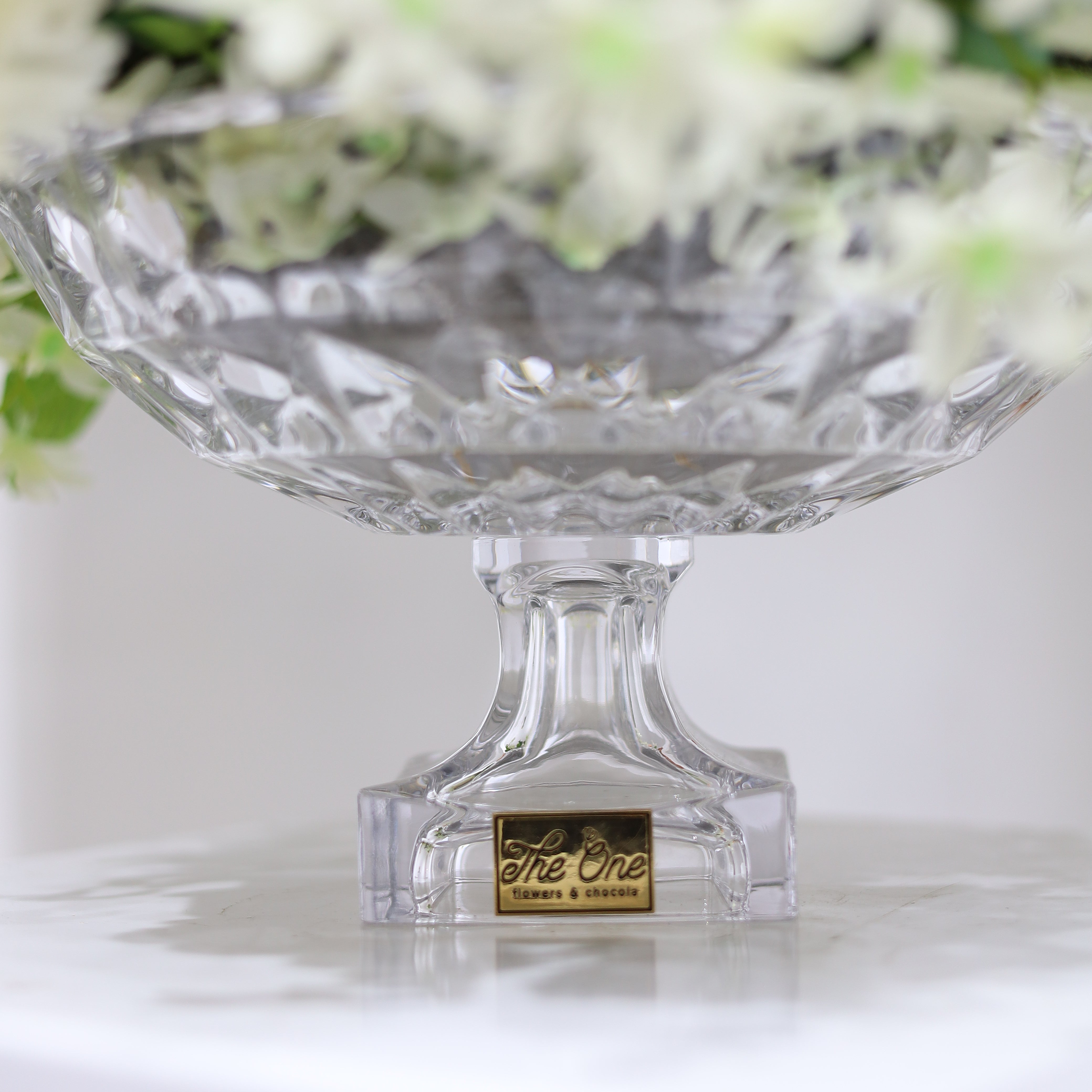 Artificial flowers with a crystal vase