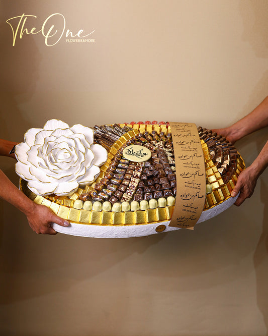 Luxury Eid Al Adha chocolate collection by The One Flowers featuring premium chocolate trays and elegant Eid gift boxes