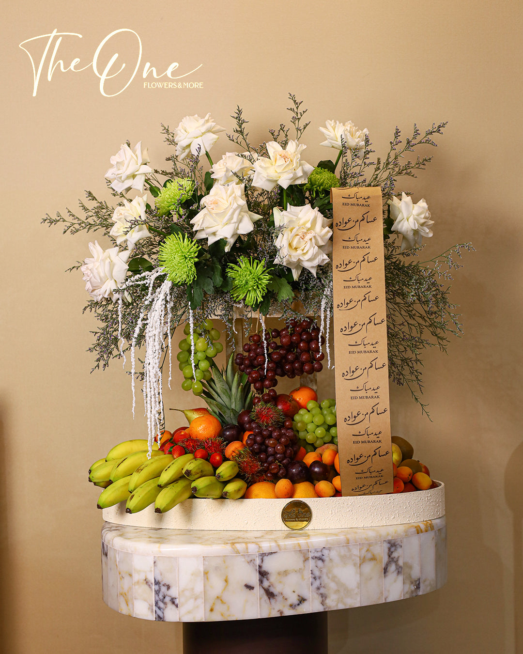 Luxury Eid Al Adha flower and fruit arrangement with white roses and fresh seasonal fruits by The One Flowers