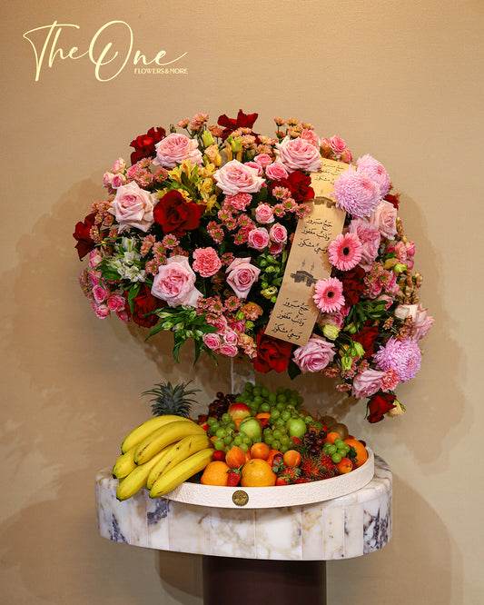 Luxury Hajj flower and fruit arrangement by The One Flowers featuring fresh flowers and seasonal fruits