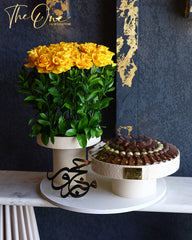 Luxury Hajj flower and chocolate arrangement by The One Flowers featuring premium fresh flowers and assorted chocolates