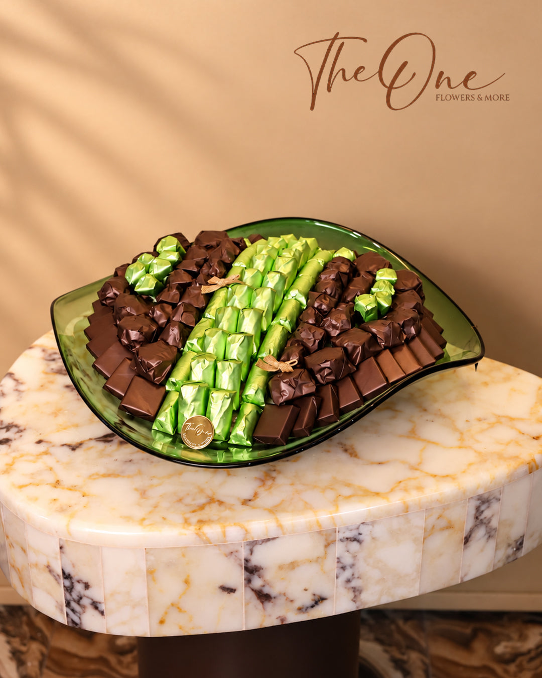 Luxury chocolate gift tray beautifully arranged with assorted wrapped chocolates by THE ONE FLOWERS, perfect for gifting and special occasions in the UAE.