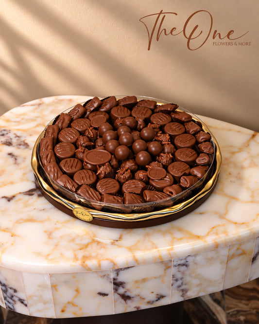 Luxury chocolate gift tray beautifully arranged with assorted wrapped chocolates by THE ONE FLOWERS, perfect for gifting and special occasions in the UAE.