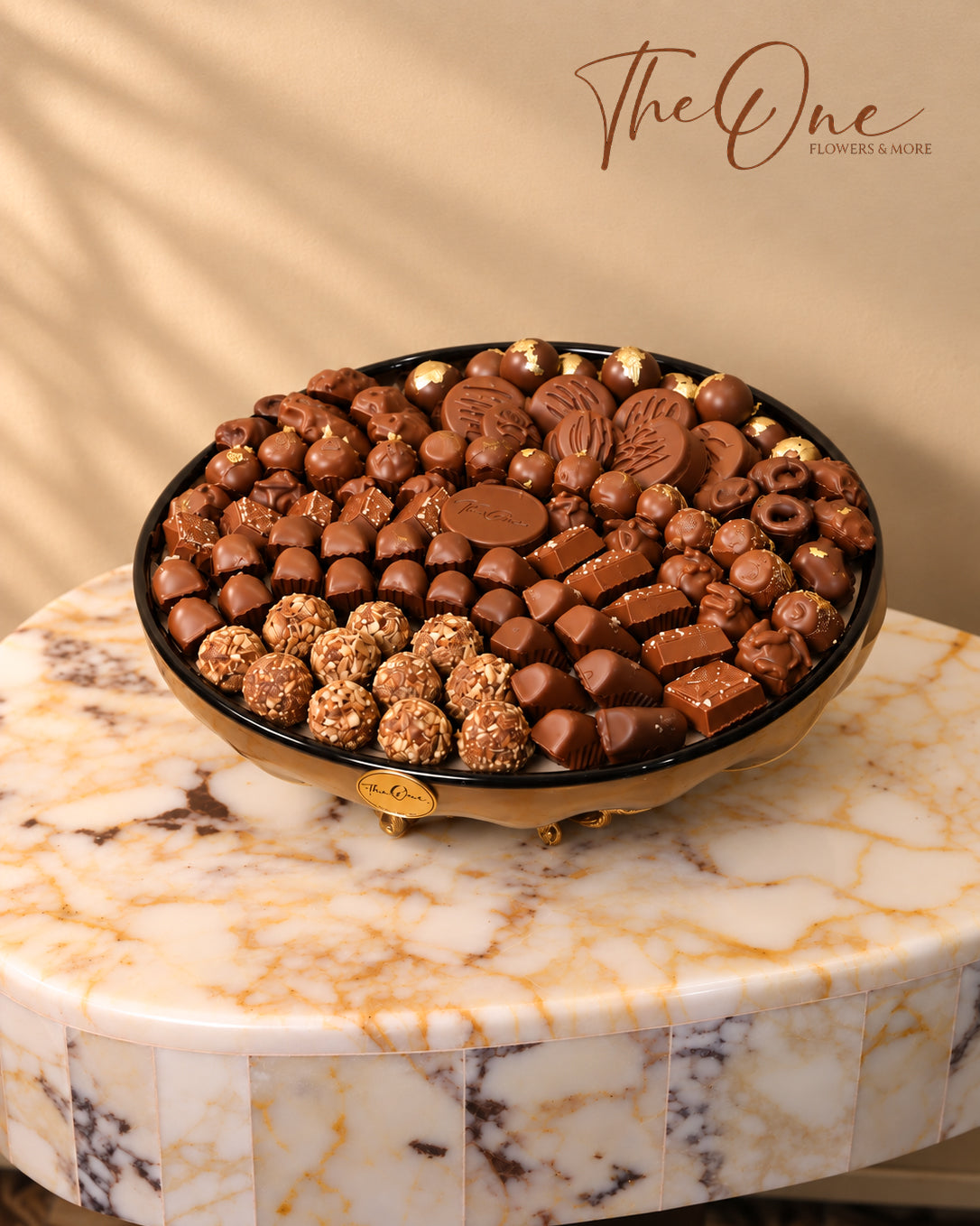 Luxury chocolate gift tray beautifully arranged with assorted wrapped chocolates by THE ONE FLOWERS, perfect for gifting and special occasions in the UAE.
