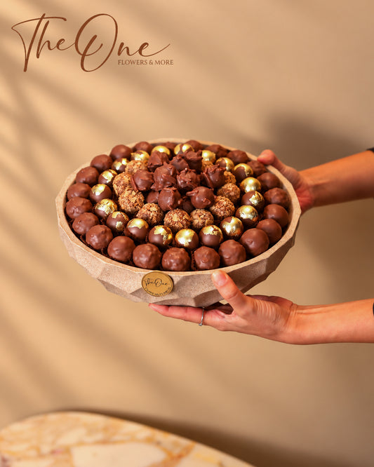 Luxury chocolate gift tray beautifully arranged with assorted wrapped chocolates by THE ONE FLOWERS, perfect for gifting and special occasions in the UAE.