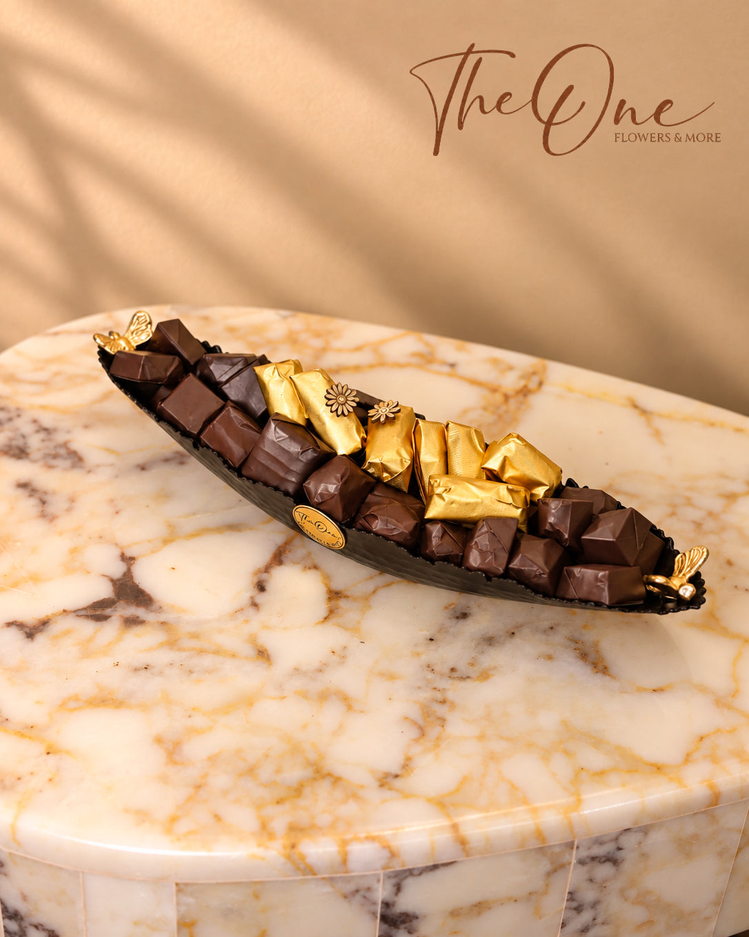 Luxury chocolate gift tray beautifully arranged with assorted wrapped chocolates by THE ONE FLOWERS, perfect for gifting and special occasions in the UAE.