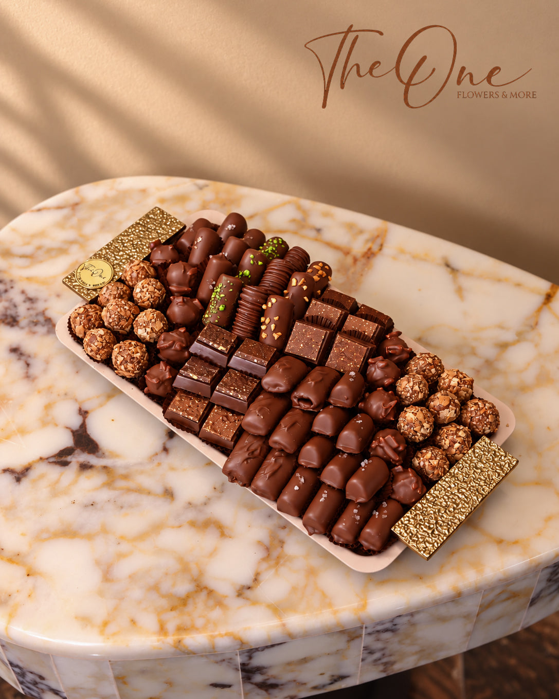 Luxury chocolate gift tray beautifully arranged with assorted wrapped chocolates by THE ONE FLOWERS, perfect for gifting and special occasions in the UAE.