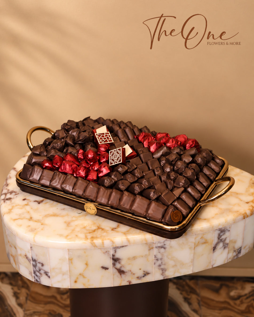 Luxury chocolate gift tray beautifully arranged with assorted wrapped chocolates by THE ONE FLOWERS, perfect for gifting and special occasions in the UAE.