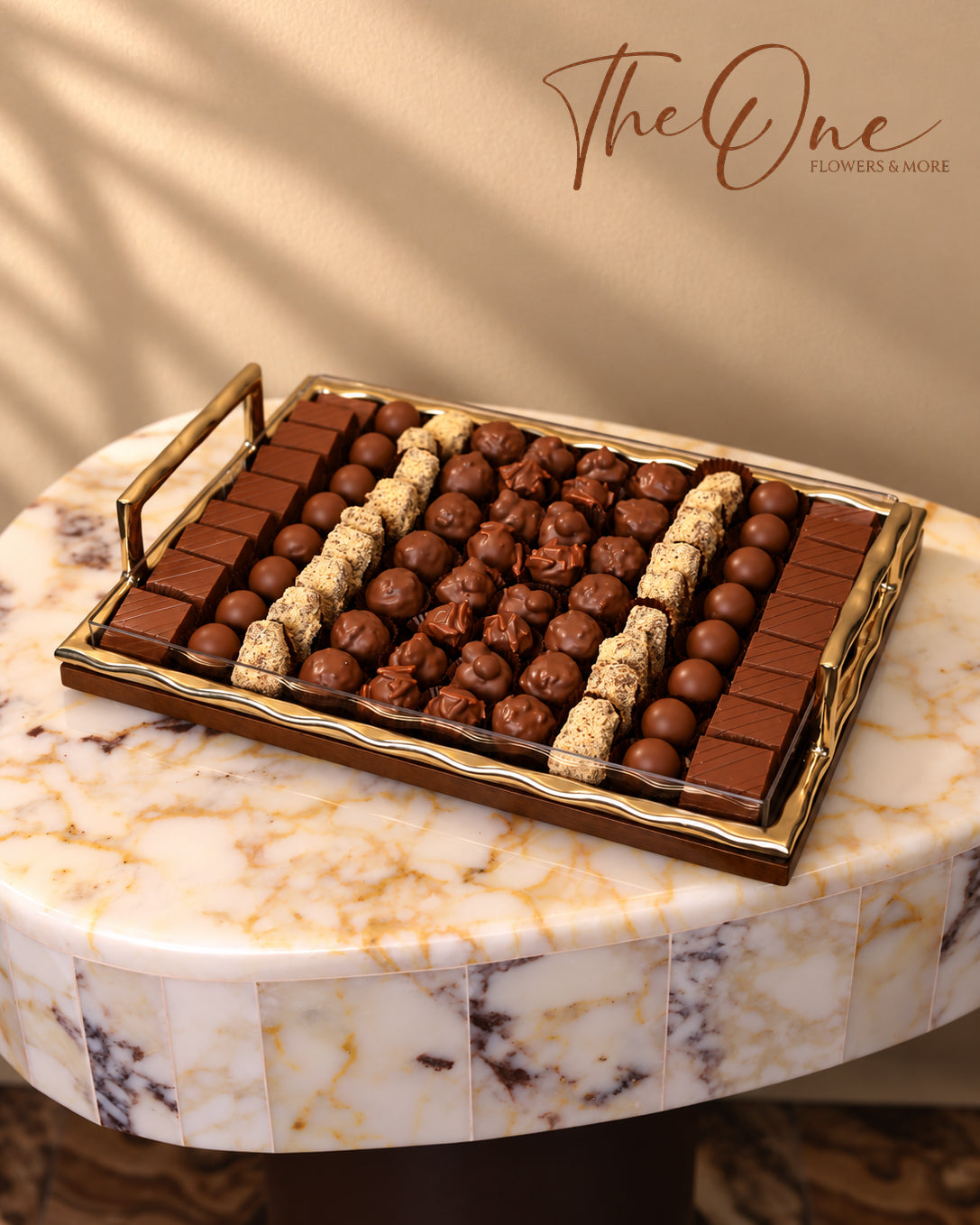 Luxury chocolate gift tray beautifully arranged with assorted wrapped chocolates by THE ONE FLOWERS, perfect for gifting and special occasions in the UAE.